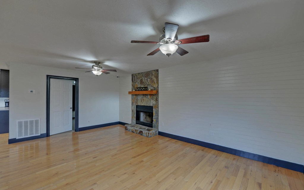 16 Bell Lane Morganton, GA 30560 - Photo 7 of 51 an empty room with windows and fan