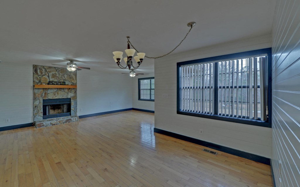 16 Bell Lane Morganton, GA 30560 - Photo 9 of 51 wooden floor in an empty room with a window