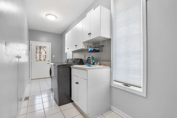 a kitchen with stainless steel appliances a refrigerator and cabinets