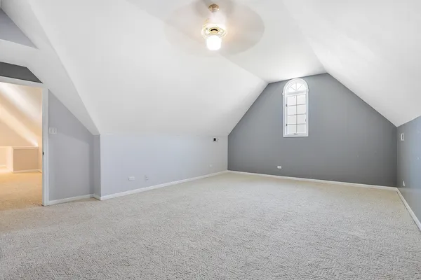 an empty room with windows and entrance