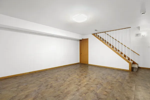 a view of an empty room with stairs