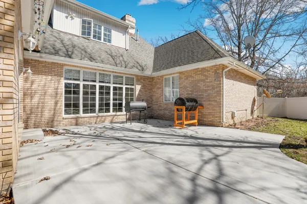 a view of a house with a outdoor space and porch
