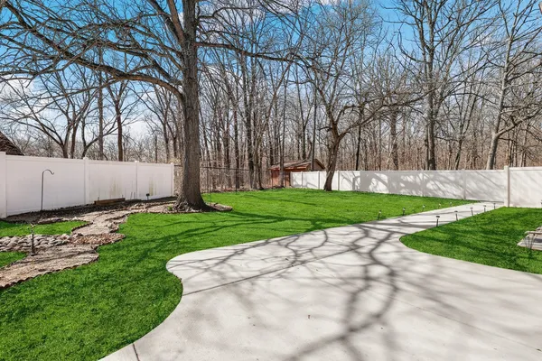 a view of a backyard with green space