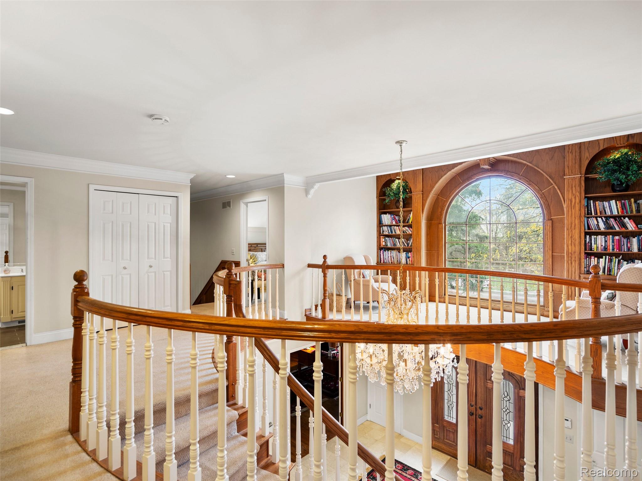 5724 Murfield Drive Rochester, MI 48306 - Photo 69 of 99 Hall with an upstairs landing, ornamental molding, recessed lighting, and light carpet
