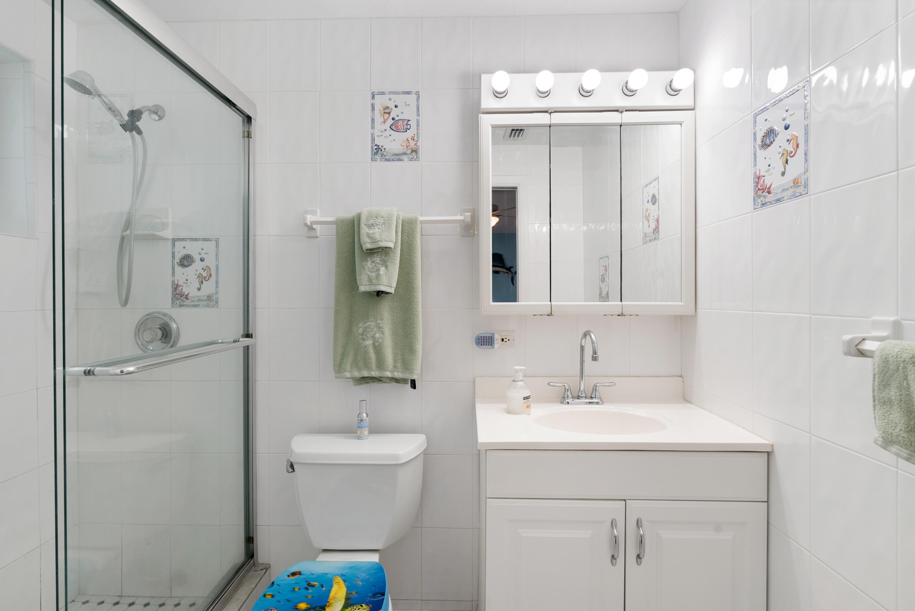 1210 Cactus Street Key Largo, FL 33037 - Photo 16 of 41 a bathroom with a sink a toilet and shower