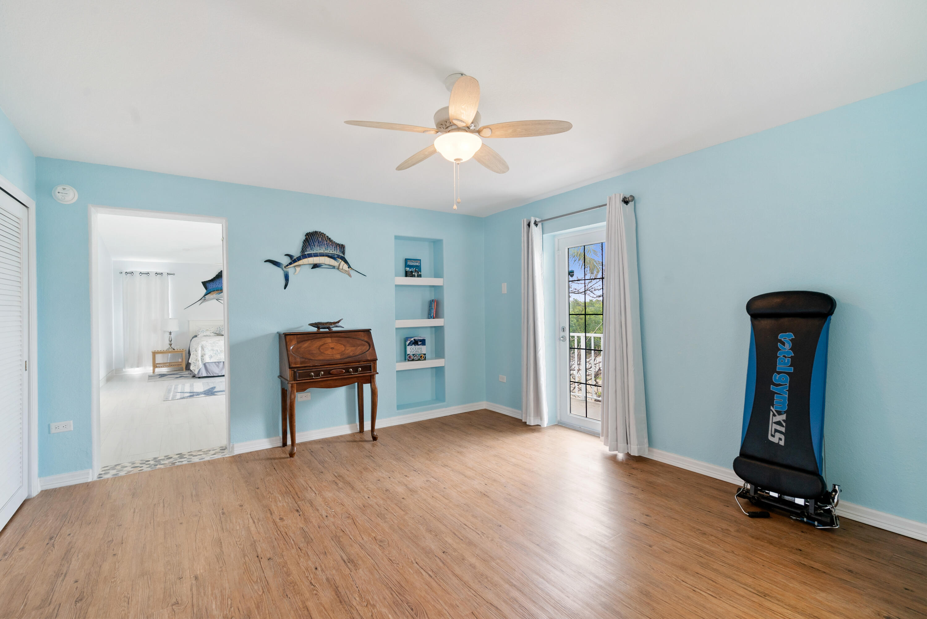 1210 Cactus Street Key Largo, FL 33037 - Photo 18 of 41 a view of empty room with a window and wooden floor