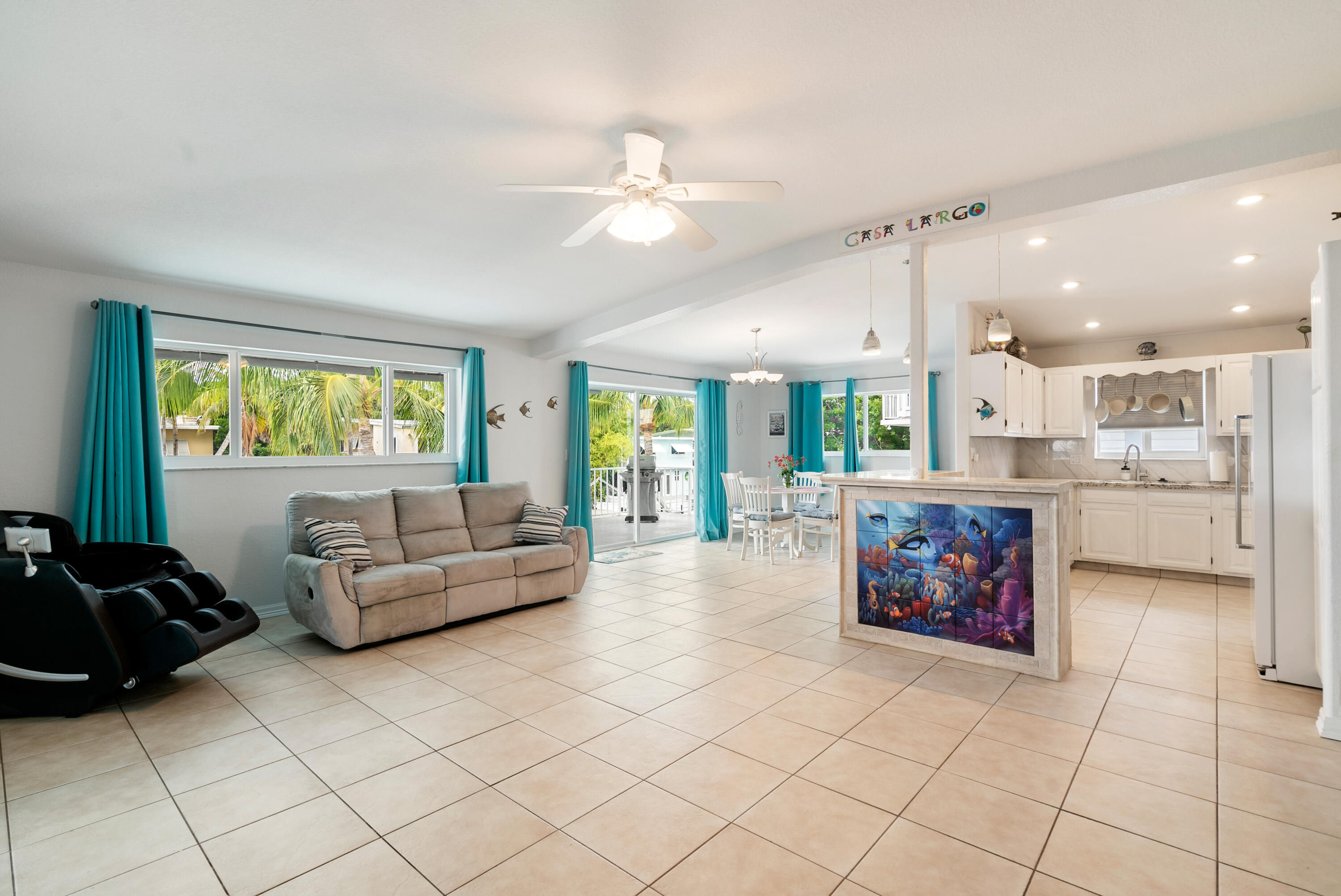 1210 Cactus Street Key Largo, FL 33037 - Photo 10 of 41 a living room with furniture and a large window