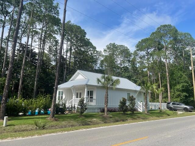 Lot 10 Churchill Bayou Road Santa Rosa Beach, FL 32459 - Photo 10 of 11 a front view of a house with a yard