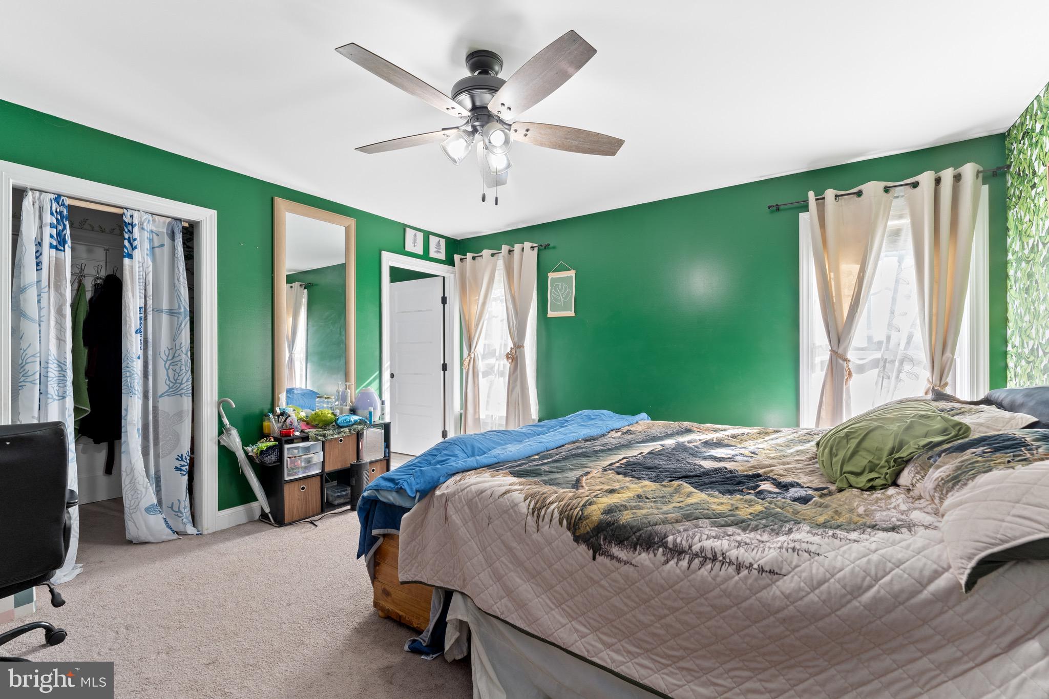 1322 Kennon Road Mineral, VA 23117 - Photo 11 of 27 a bedroom with a bed and a chandelier