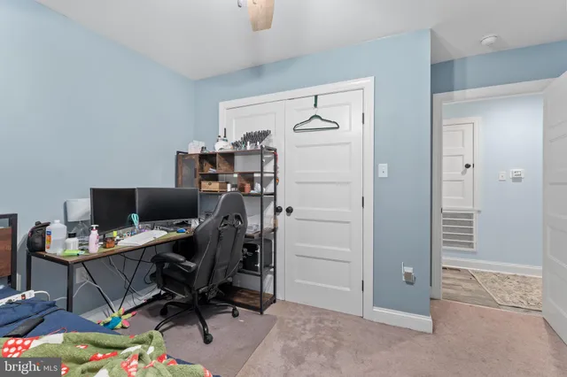 a bedroom with a bed and flat screen tv