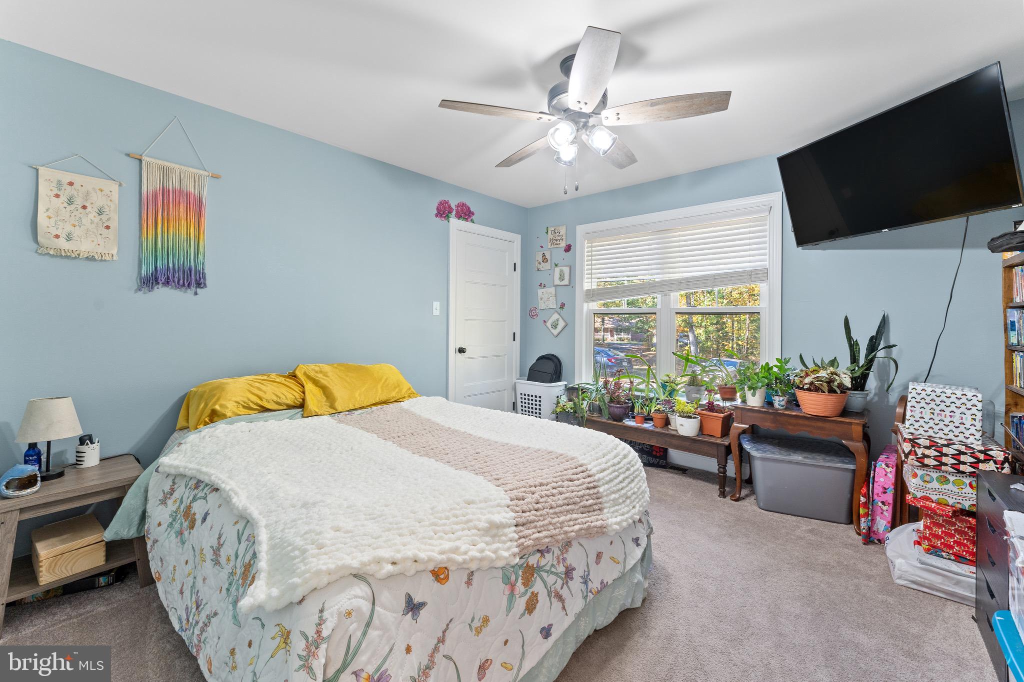 1322 Kennon Road Mineral, VA 23117 - Photo 15 of 27 a bedroom with a bed and flat screen tv