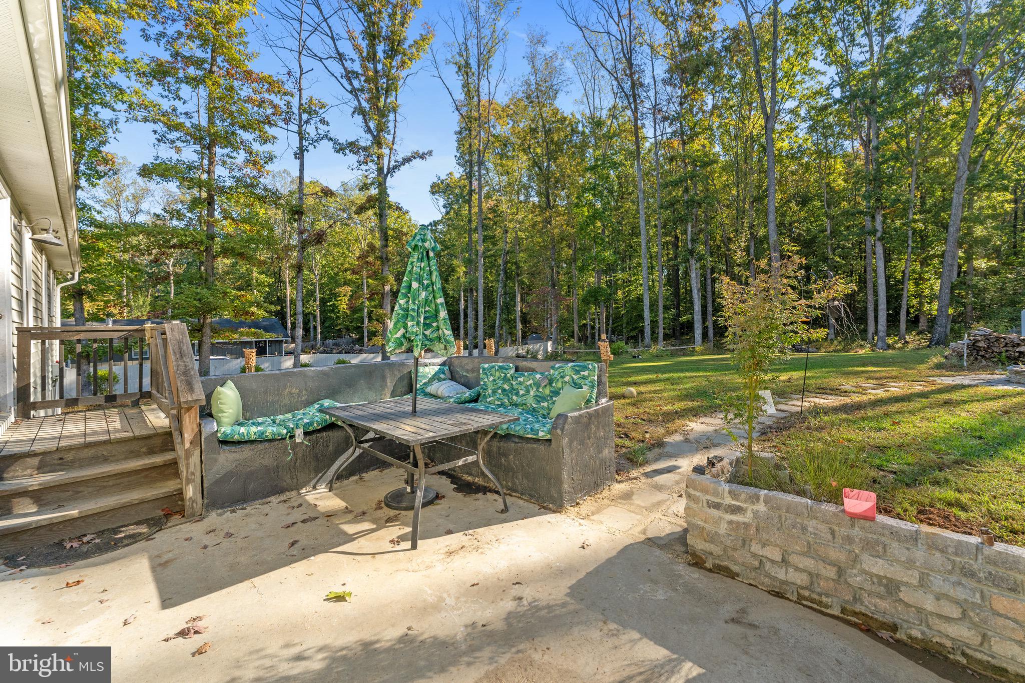 1322 Kennon Road Mineral, VA 23117 - Photo 22 of 27 a view of a patio with a table and chairs