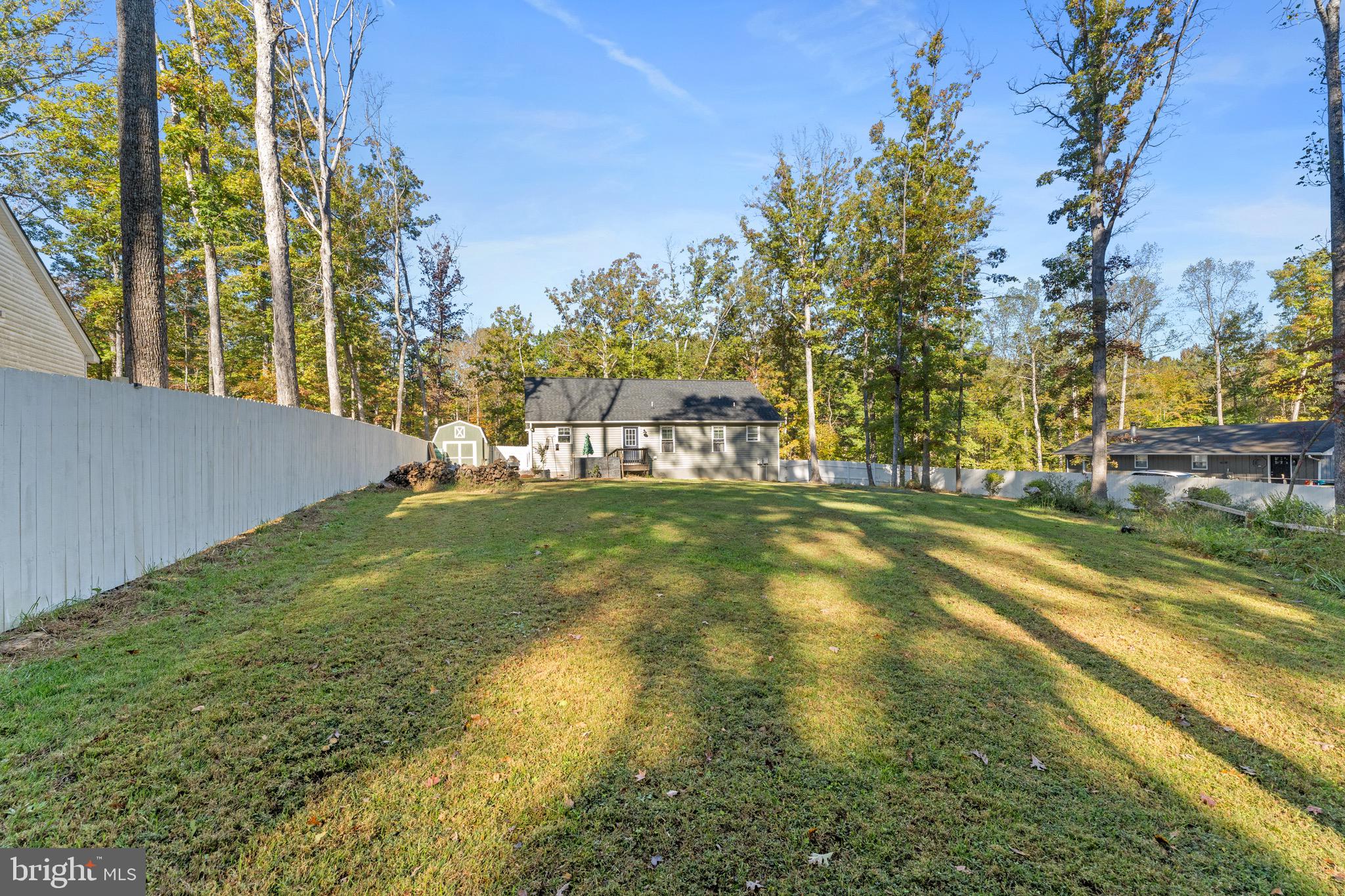 1322 Kennon Road Mineral, VA 23117 - Photo 25 of 27 a view of yard with swimming pool and green space