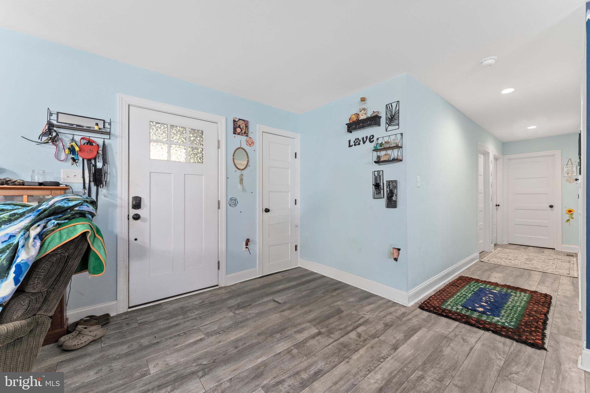 1322 Kennon Road Mineral, VA 23117 - Photo 4 of 27 a view of livingroom with hardwood floor and a ceiling fan