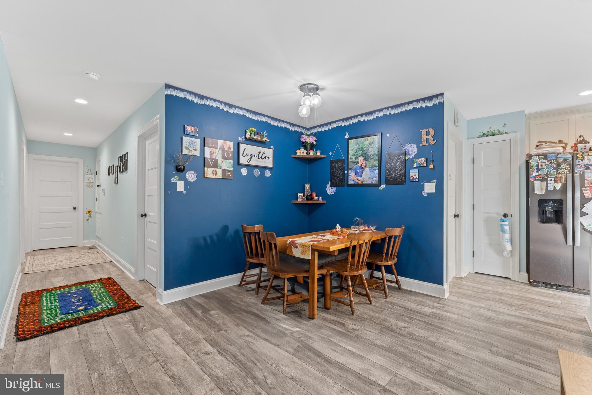 1322 Kennon Road Mineral, VA 23117 - Photo 5 of 27 a view of a dining room with furniture and wooden floor
