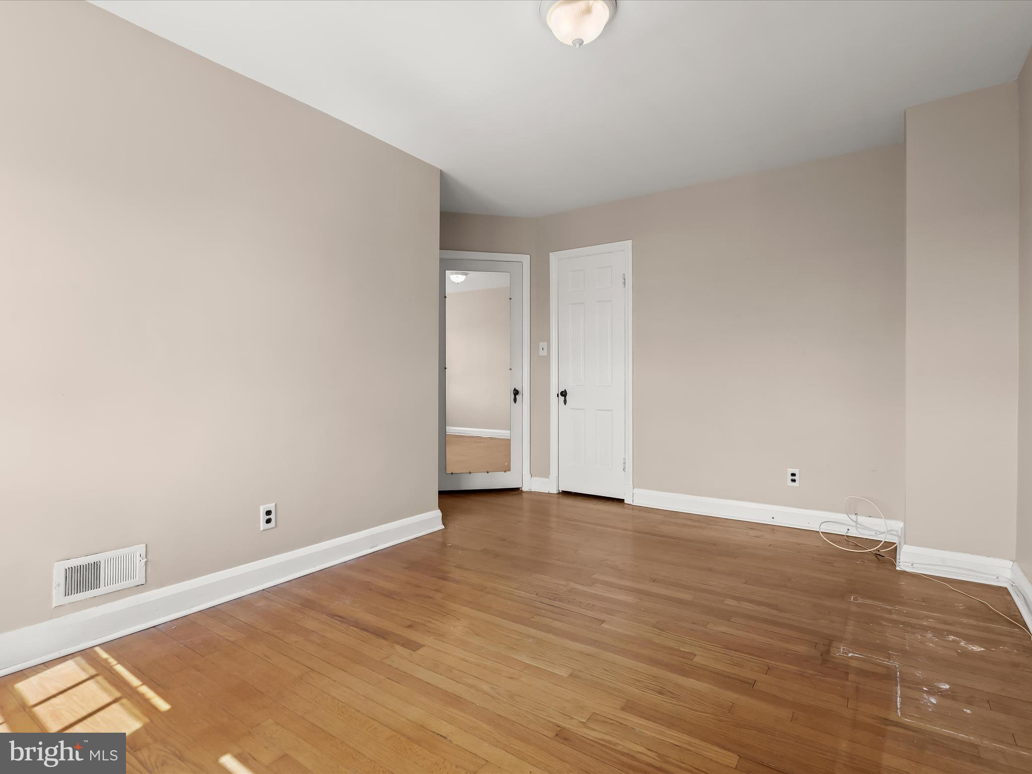 415 Whitfield Road Catonsville, MD 21228 - Photo 24 of 43 a view of an empty room with wooden floor