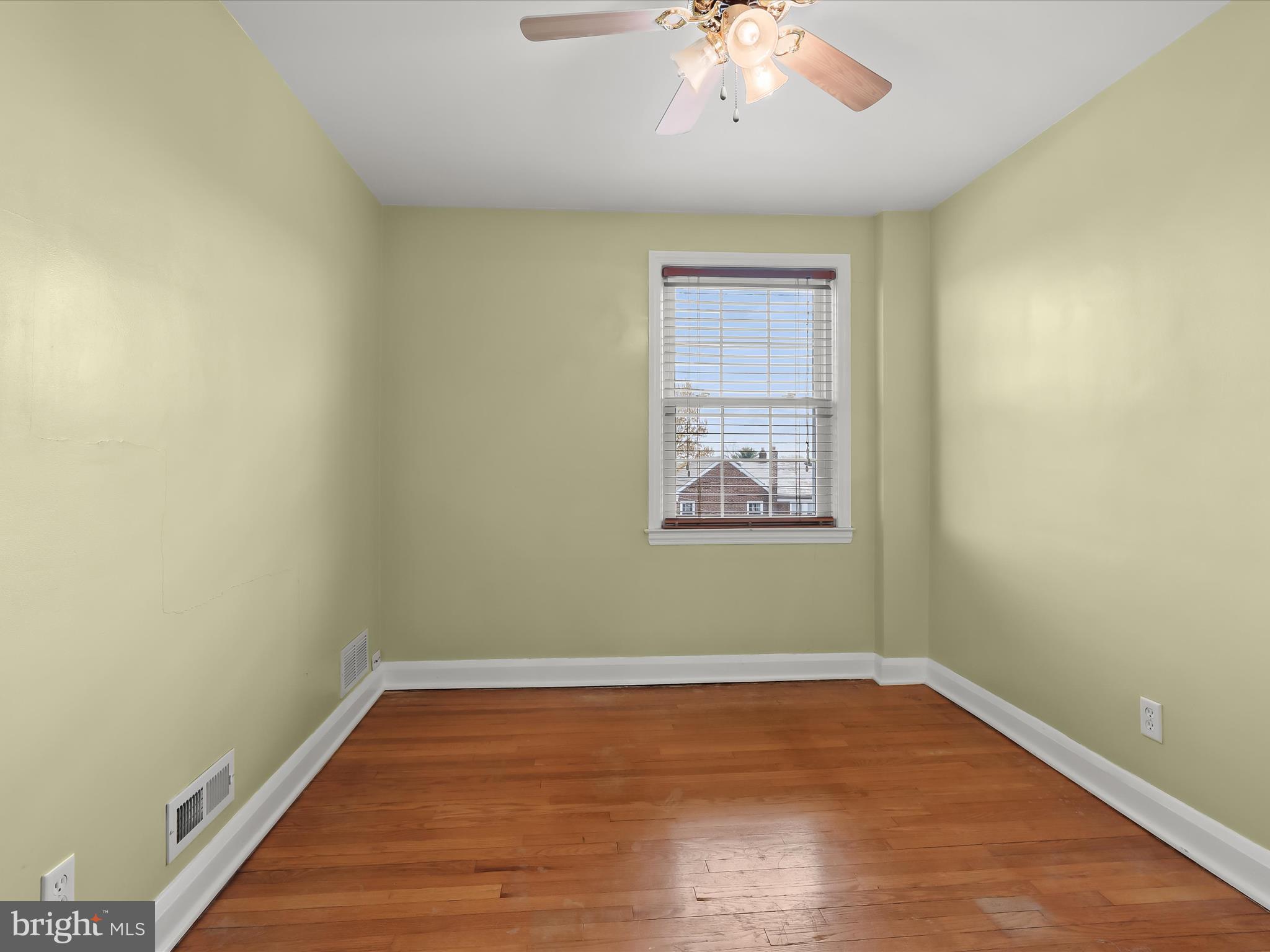 415 Whitfield Road Catonsville, MD 21228 - Photo 26 of 43 wooden floor in an empty room with a window