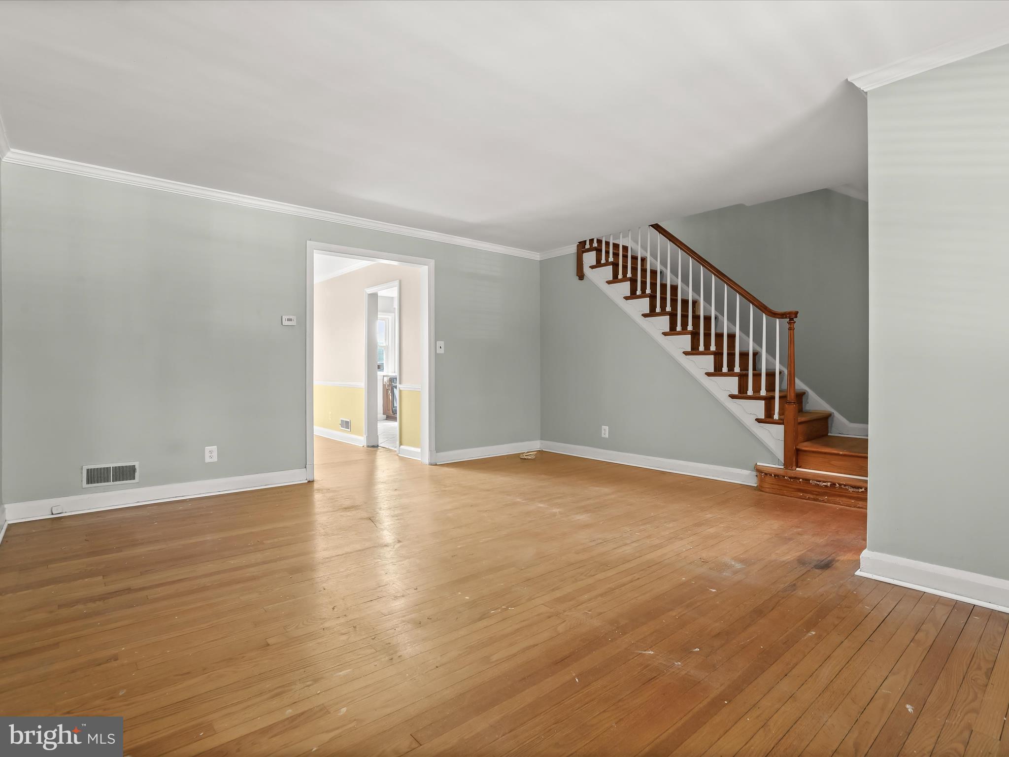 415 Whitfield Road Catonsville, MD 21228 - Photo 10 of 43 a view of an empty room with wooden floor and stairs