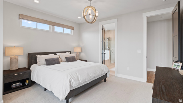 355 East Overlook Loop Hideout, UT 84036 - Photo 17 of 40 Spacious Primary suite featuring light-colored carpeting, recessed lighting, and a contemporary spherical chandelier