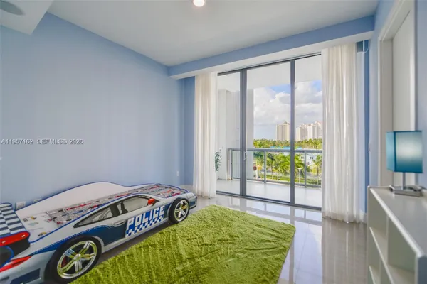 a car parked in front of a yellow room