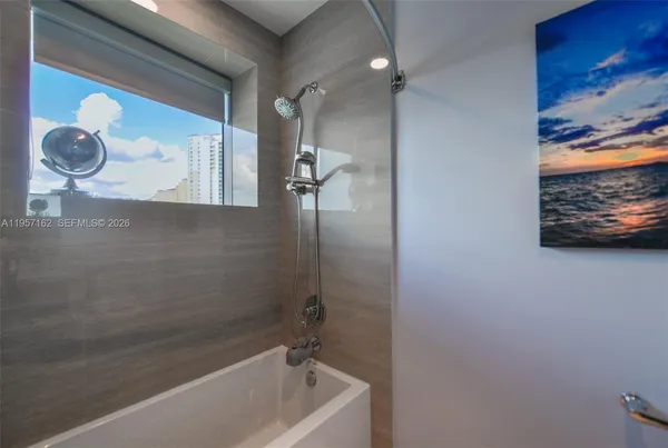 a bathroom with a sink mirror toilet and vanity