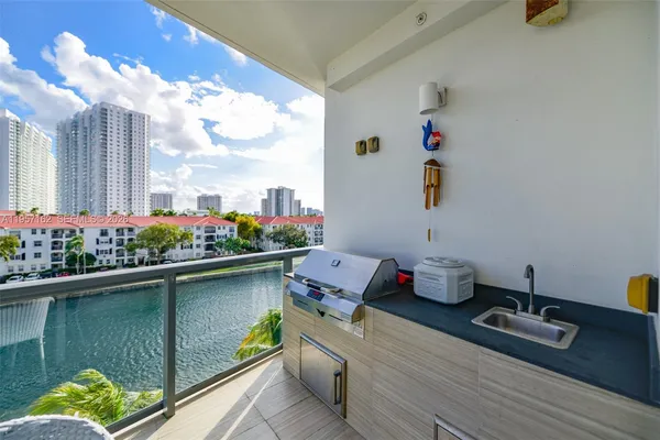 a bathroom with a toilet sink vanity and curtain
