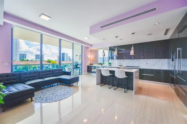 a living room with a couch and a large window