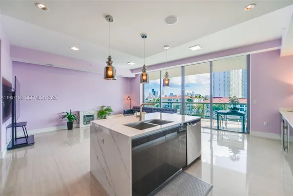 a kitchen with a sink and microwave