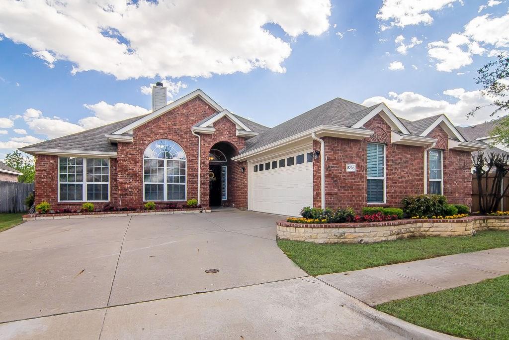 8205 Rancho De La Osa Trail McKinney, TX 75070 - Photo 1 of 1 a front view of a house with a garden and trees