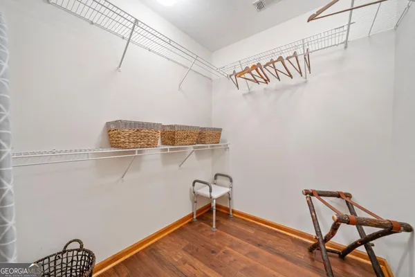 a bathroom with a double vanity sink toilet mirror and shower