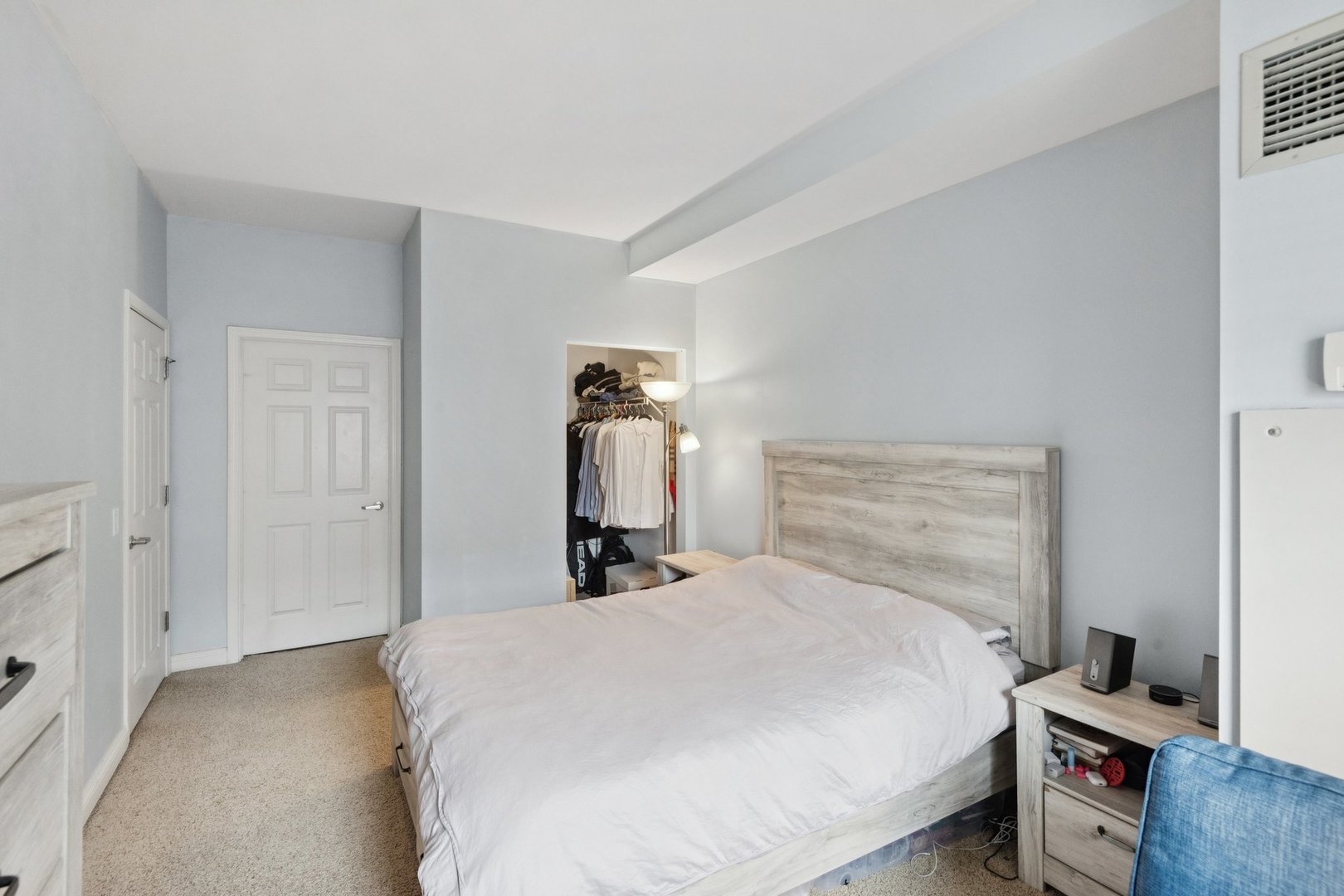 8 West Monroe Street, Unit 1209 Chicago, IL 60603 - Photo 11 of 24 a bedroom with a bed and a tv on the dresser