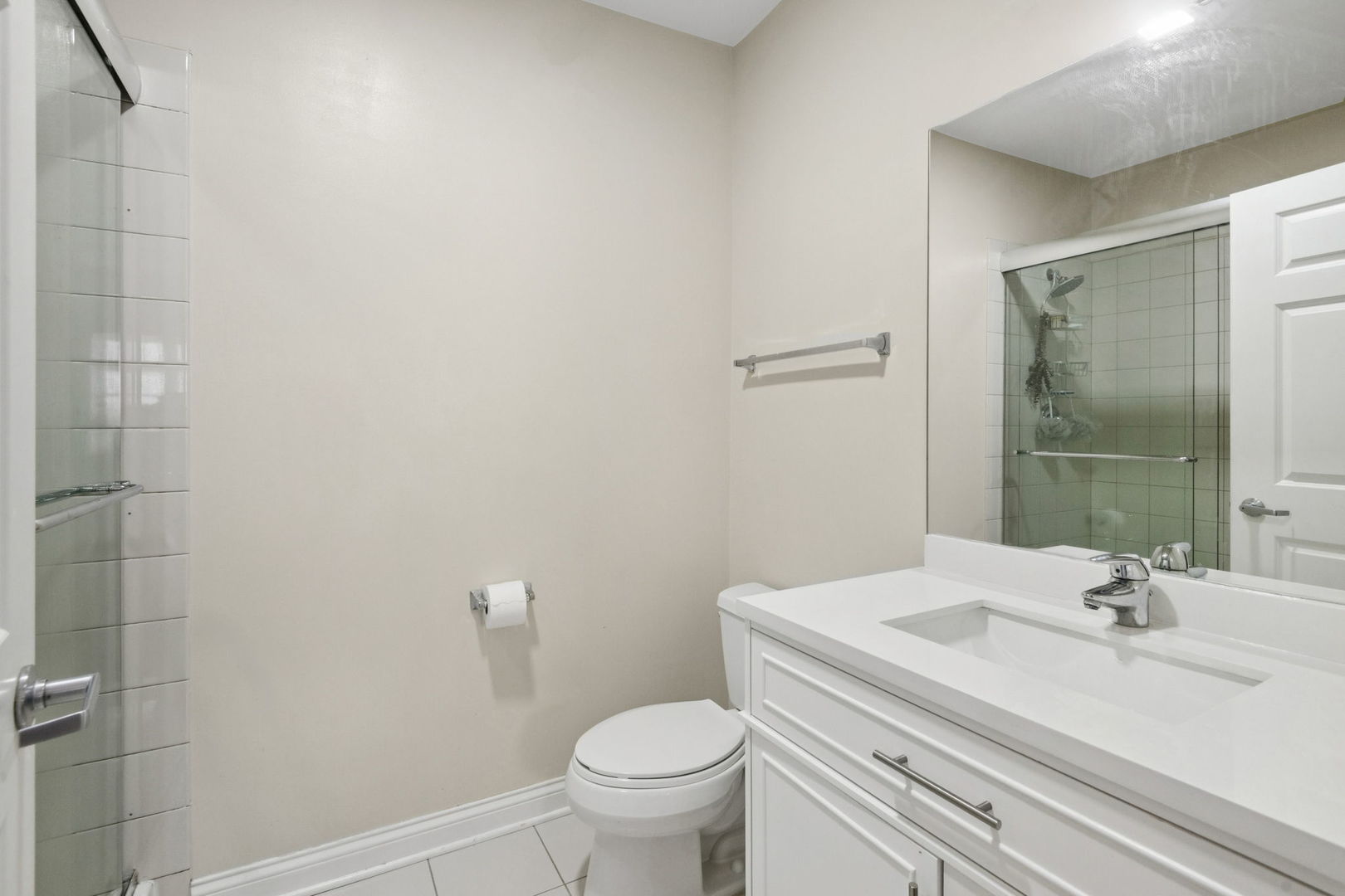 8 West Monroe Street, Unit 1209 Chicago, IL 60603 - Photo 12 of 24 a bathroom with a sink toilet and shower