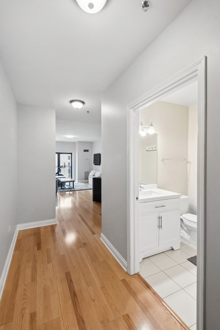 8 West Monroe Street, Unit 1209 Chicago, IL 60603 - Photo 2 of 24 a bathroom with a sink and a toilet