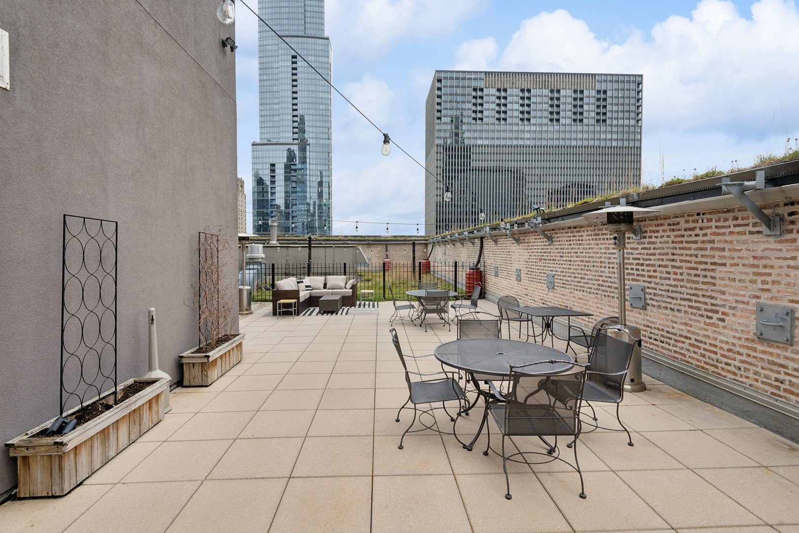 8 West Monroe Street, Unit 1209 Chicago, IL 60603 - Photo 22 of 24 a view of balcony with chairs and tables