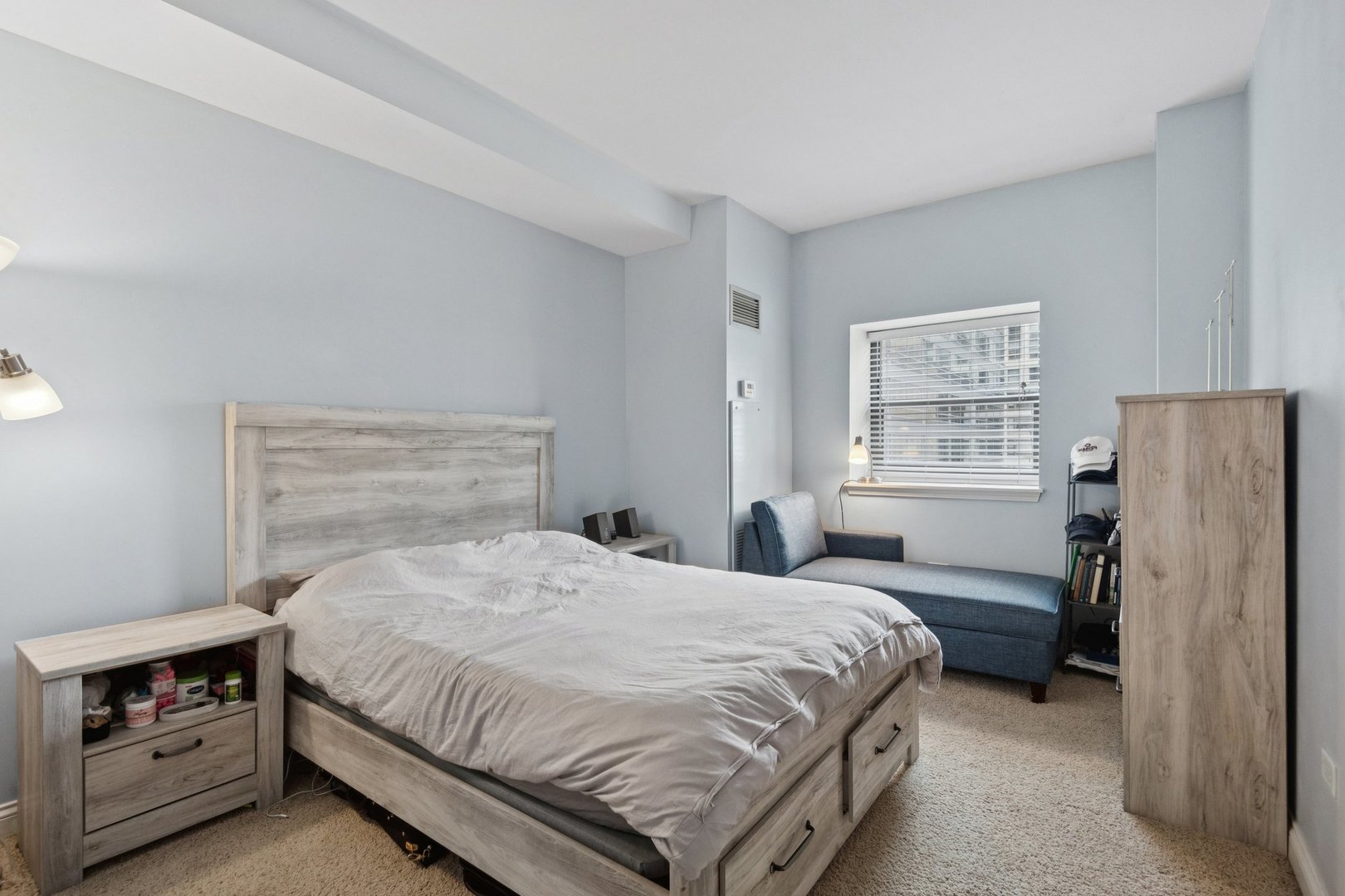 8 West Monroe Street, Unit 1209 Chicago, IL 60603 - Photo 10 of 24 a bedroom with a bed and a window