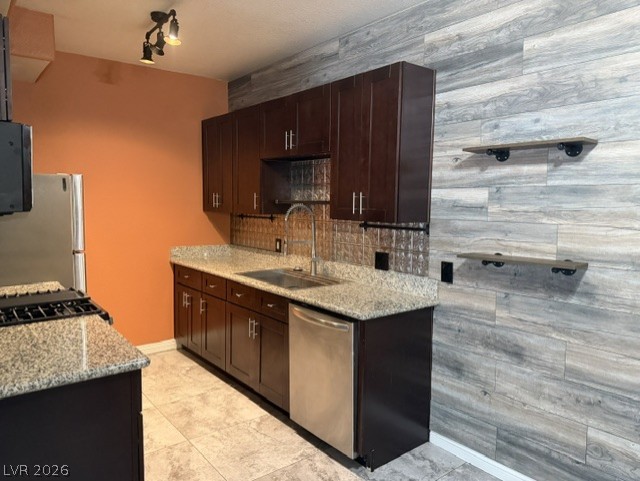 3318 North Decatur Boulevard, Unit 1163 Las Vegas, NV 89130 - Photo 19 of 35 Modern kitchen with granite countertops and stainless steel appliances awaits culinary adventures.
