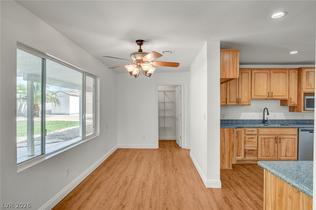 1810 Pinto Road Henderson, NV 89002 - Photo 24 of 53 Natural light illuminates this dining area, featuring a convenient pantry and an open flow to the kitchen.