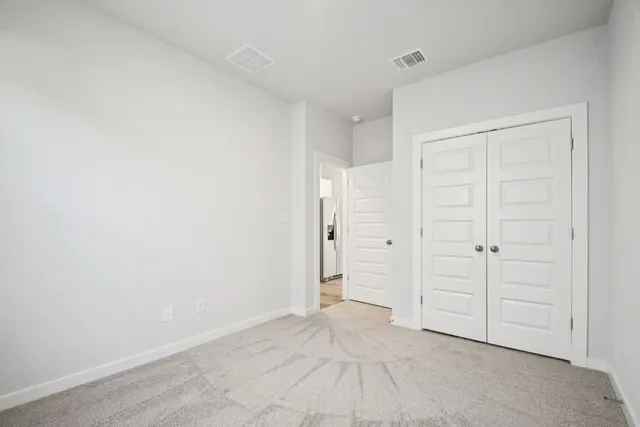 a view of a kitchen with a couple of chairs
