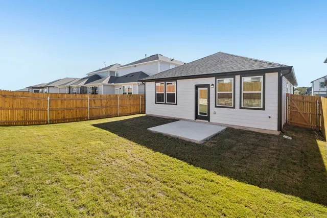 a view of a patio with dining table and chairs