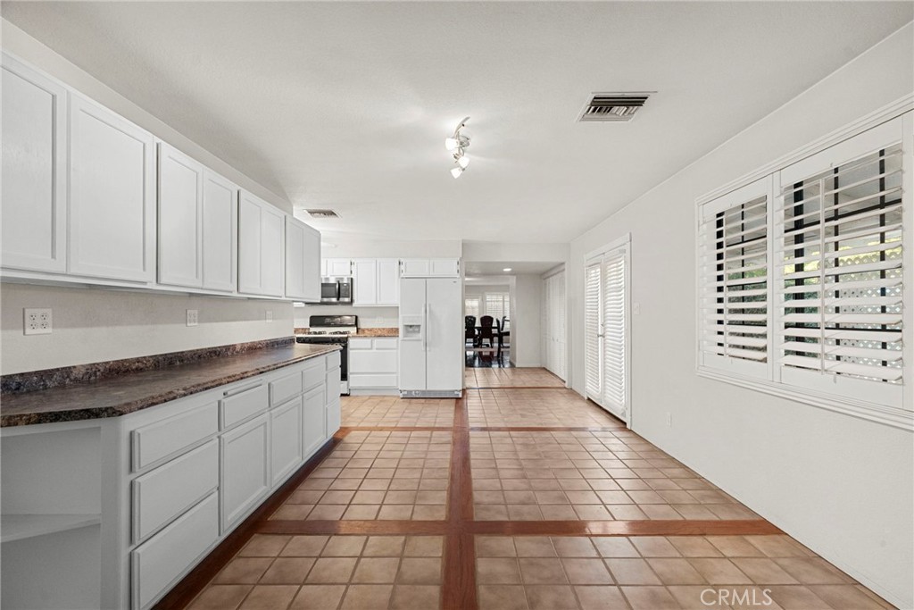 4790 Adam Road Simi Valley, CA 93063 - Photo 12 of 61 a large kitchen with cabinets