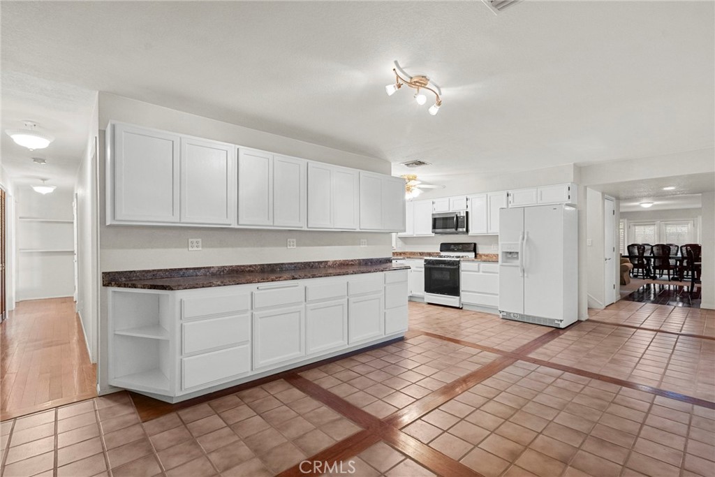 4790 Adam Road Simi Valley, CA 93063 - Photo 13 of 61 a kitchen with stainless steel appliances granite countertop a stove a sink and a refrigerator