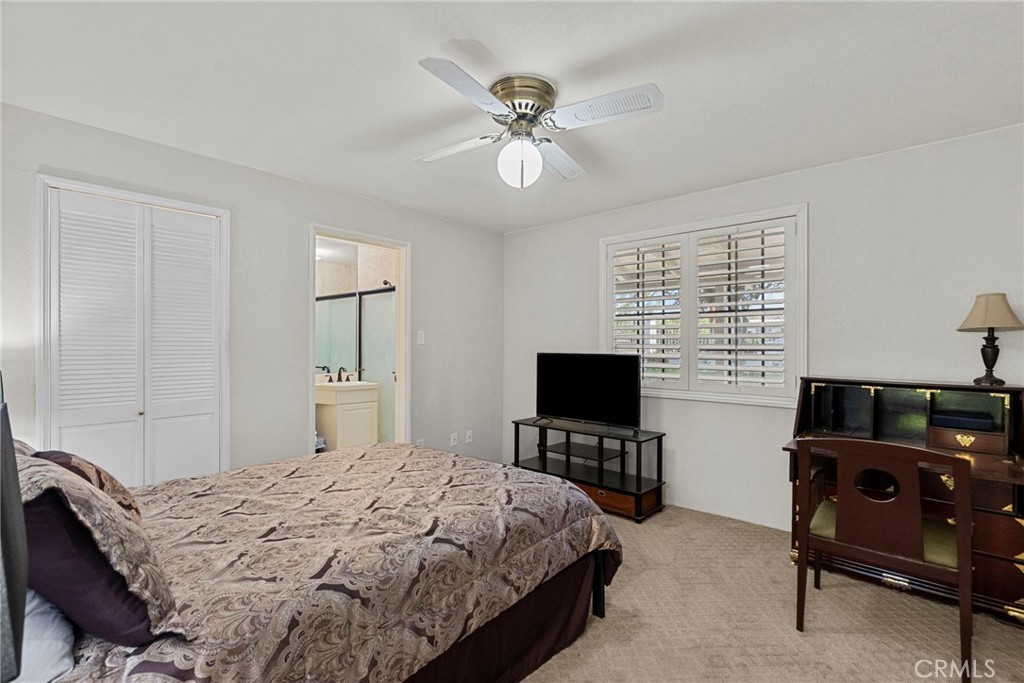 4790 Adam Road Simi Valley, CA 93063 - Photo 19 of 61 a bedroom with a bed and a flat screen tv