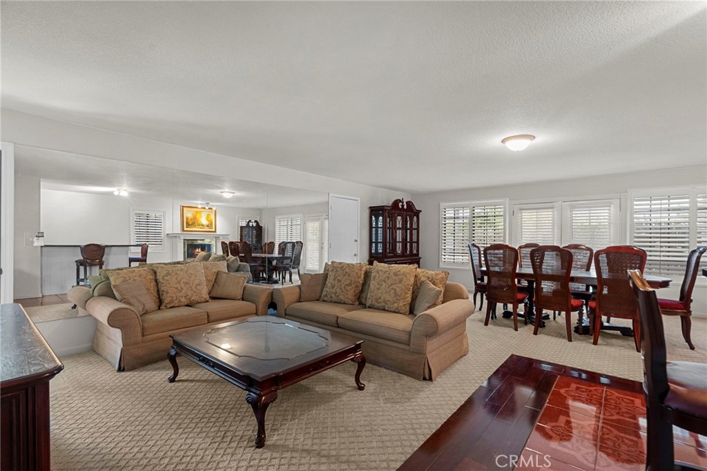 4790 Adam Road Simi Valley, CA 93063 - Photo 27 of 61 a living room with furniture potted plant kitchen view and a window