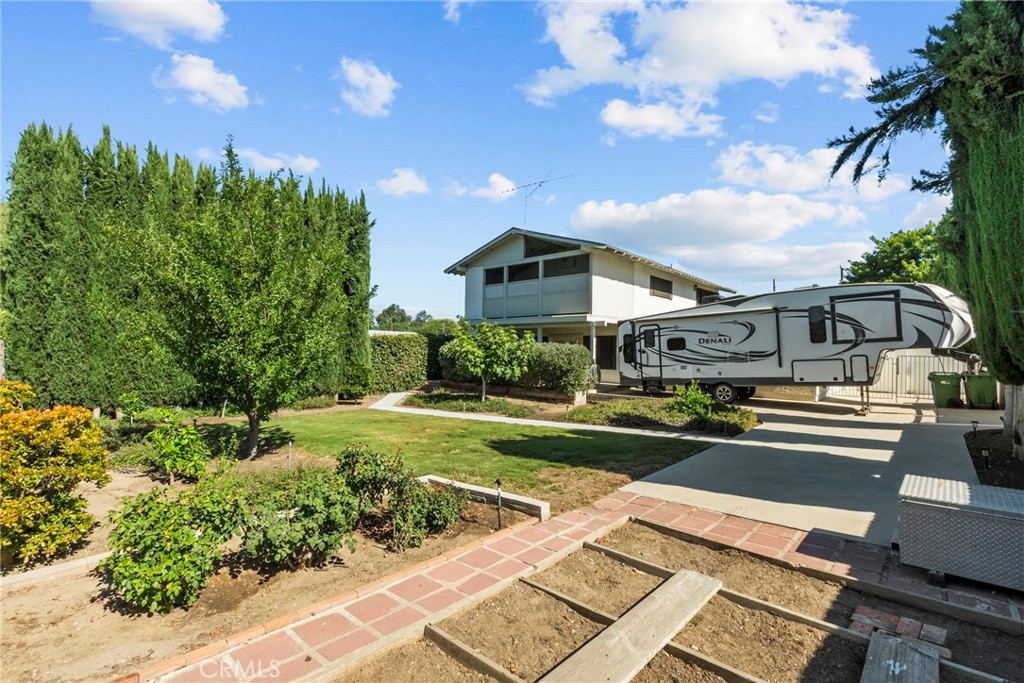 4790 Adam Road Simi Valley, CA 93063 - Photo 45 of 61 a front view of a house with a yard