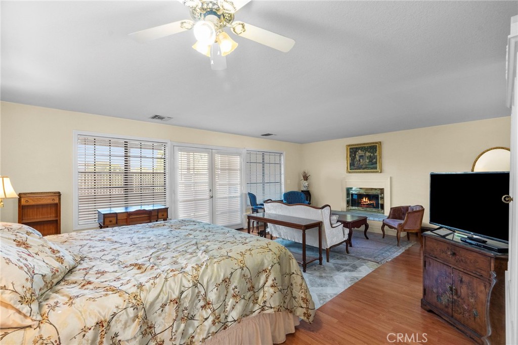 4790 Adam Road Simi Valley, CA 93063 - Photo 49 of 61 a bedroom with a bed and a flat screen tv