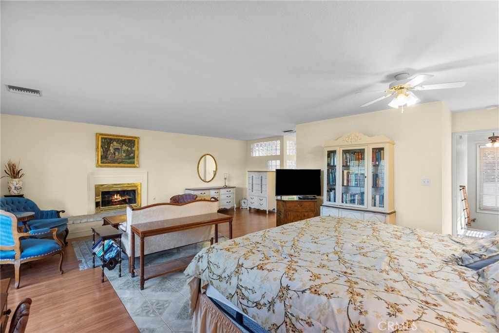 4790 Adam Road Simi Valley, CA 93063 - Photo 50 of 61 a bedroom with a bed a chandelier and mirror