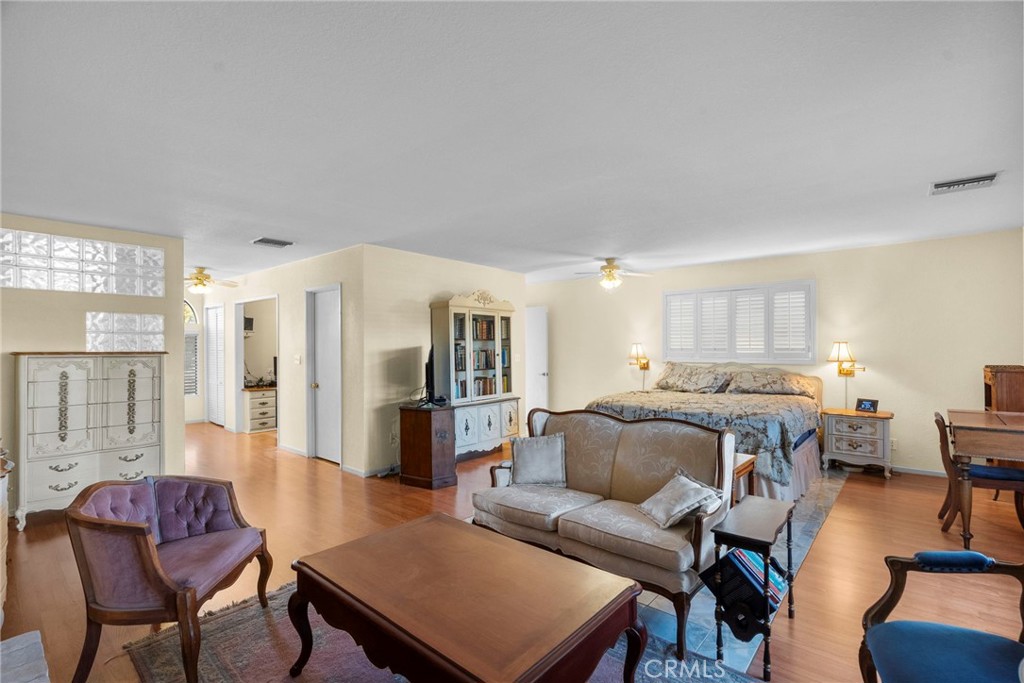 4790 Adam Road Simi Valley, CA 93063 - Photo 52 of 61 a living room with furniture and a dining table with kitchen view