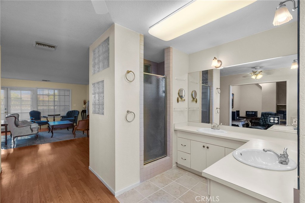 4790 Adam Road Simi Valley, CA 93063 - Photo 55 of 61 a large bathroom with a glass door shower and sink