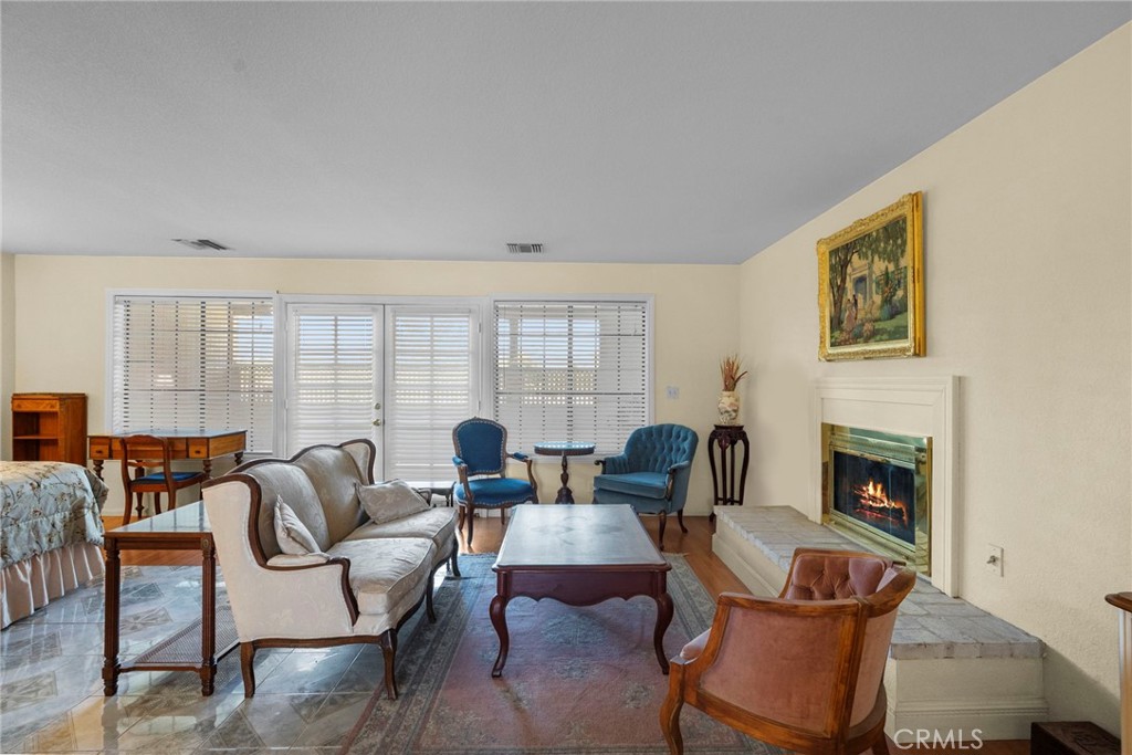4790 Adam Road Simi Valley, CA 93063 - Photo 56 of 61 a living room with furniture and a fireplace