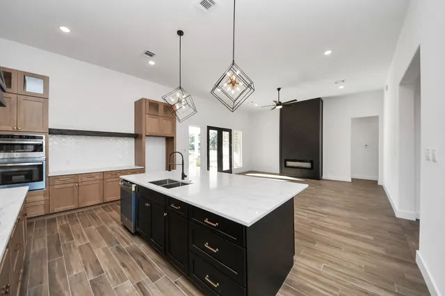a kitchen with a sink and cabinets